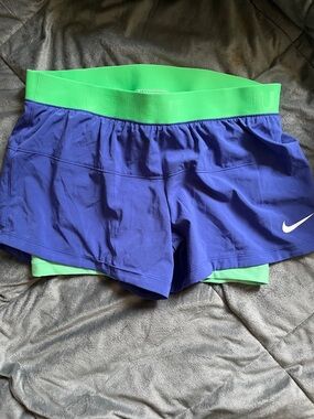 Nike Women's Blue Athletic Shorts with Green Waistband